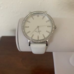 Kate Spade watch with leather band. Minor wear/discoloration where band rubbed.